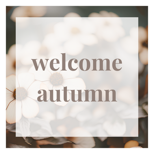 a floral background with brown text saying "welcome autumn"