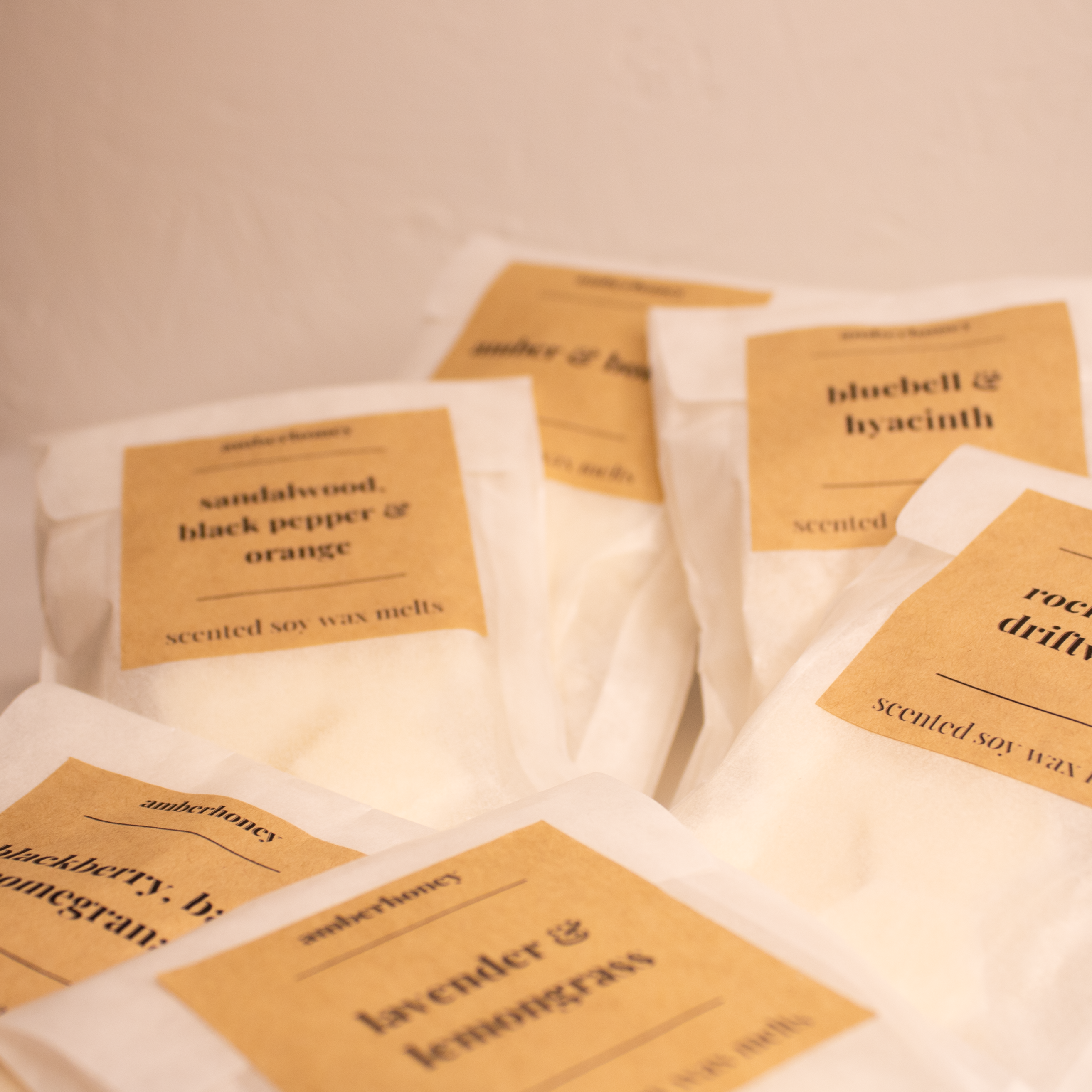 a stack of wax melts from the amberhoney collection